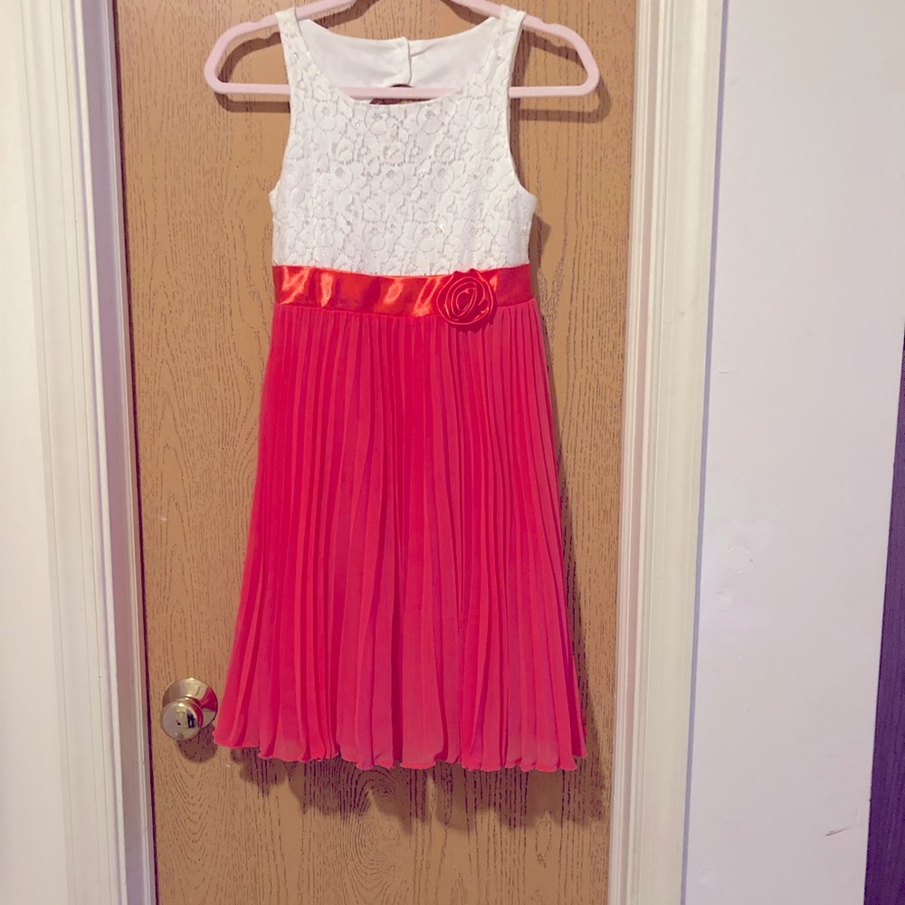 Whit lacy top with pink pleated bottom dress. Size 14 for a girl.
